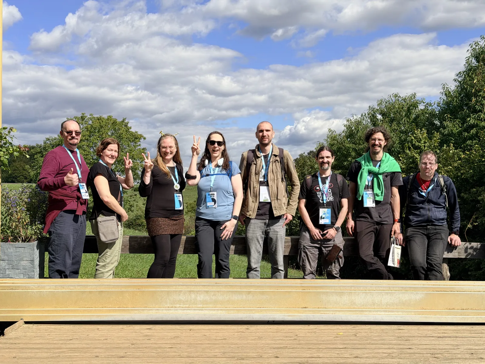 Several KDE folks, totally blocking the view of the castle in the distance